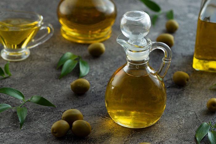 high view bottles filled with olive oil marble background 0