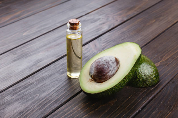 little bottle with oil avocado stand wooden table 8353 7044 0